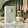 Une photo luxueuse du flacon Juman Exclusive 100ml et du coffret cadeau, sur une surface en marbre avec des perles, des pétales de rose et des accents décoratifs.