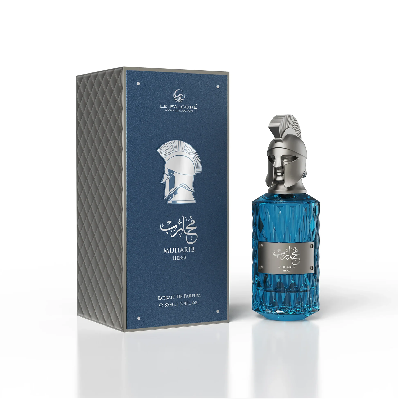 A premium product presentation of Le Falconé Muharib Hero Extrait de Parfum, featuring the 85ml blue glass bottle displayed beside its elegant, textured blue gift box, showcasing the iconic silver Spartan helmet design.