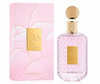 Displays the Ria by Khadlaj perfume bottle alongside its beautifully designed floral presentation box. The composition emphasizes the delicate pink color palette, gold details, and sophisticated packaging, enhanced by soft studio lighting and a seamless white background.